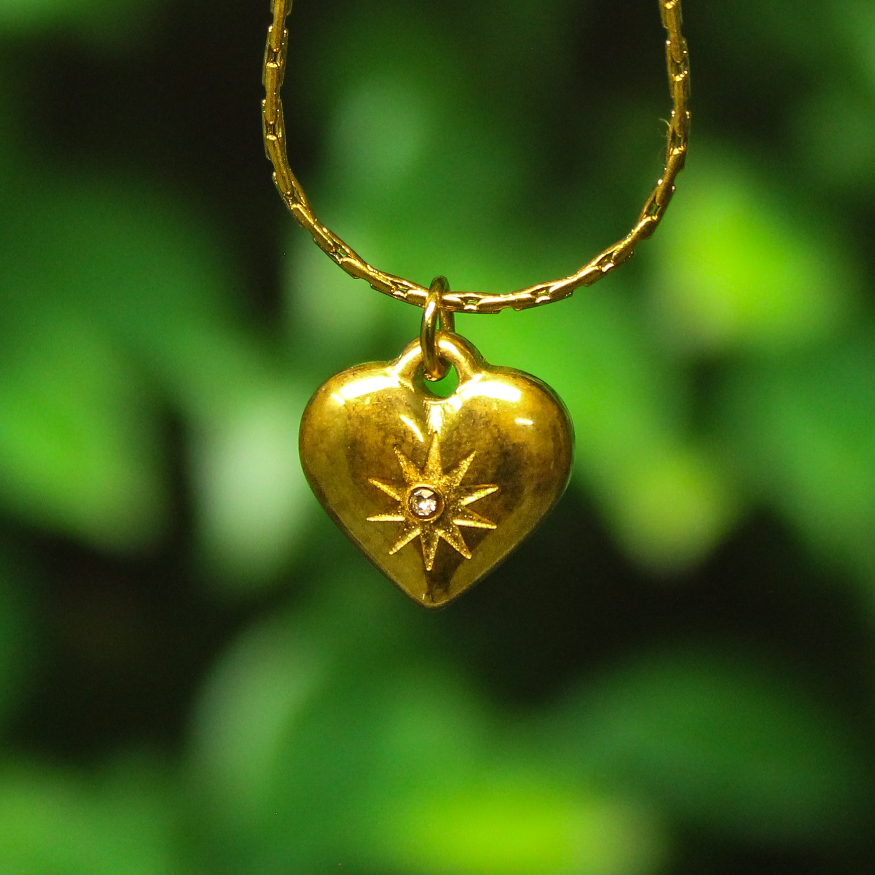 Ani tarnish gald chain with heart pendant hanging on a tree